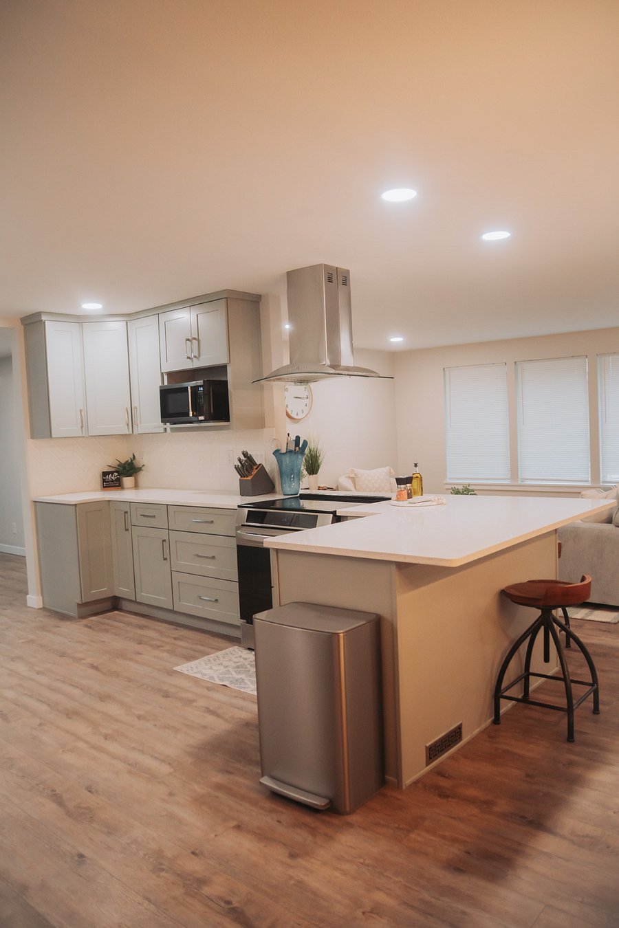 The induction stove top (induction cookware included) looks out onto the main street and front living room