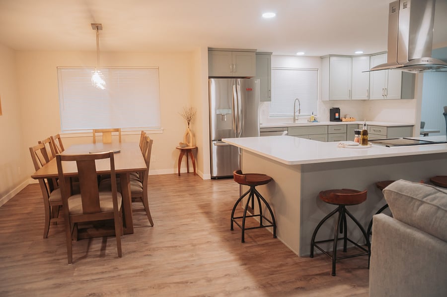 The beautiful eight foot dining table and spacious kitchen