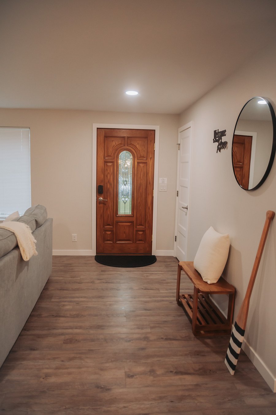 Walk through the front door to the first living room - note the full coat closet to the right for easy storage