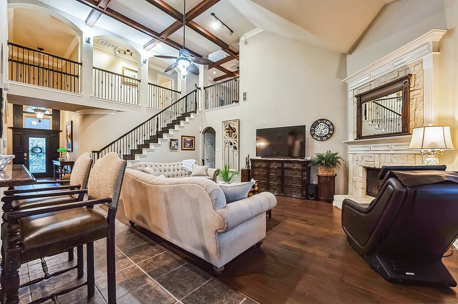 Great room with bar seating and staircase