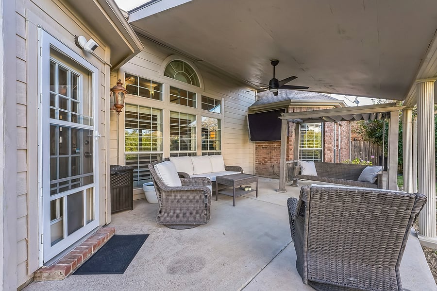 Covered patio with TV and seating