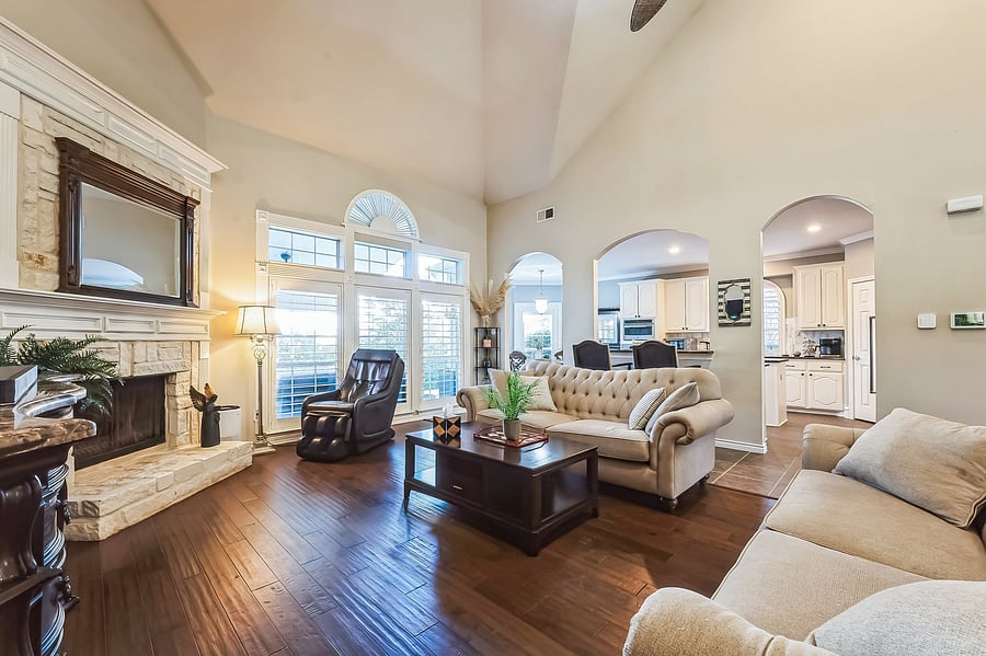 Great room with stone fireplace and massage chair