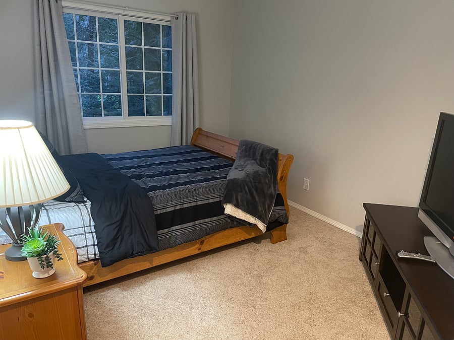 Bedroom 3. Lights line the ceiling with adjustable colors.  Smart big screen TV.