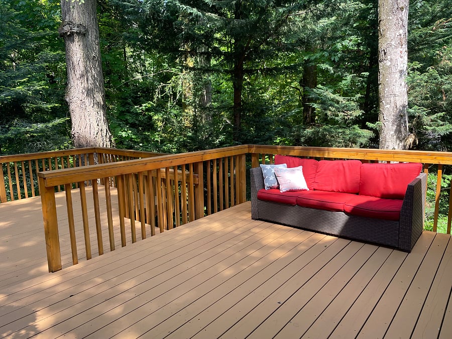 Spacious deck.  Not pictured: Loveseat, new cushions for it and couch, white and blue.  Traeger and bar b q.  Table that seats 6.  Additional table that seats 4.  Small fenced space with Japanese Maple for dogs to do their business :). 