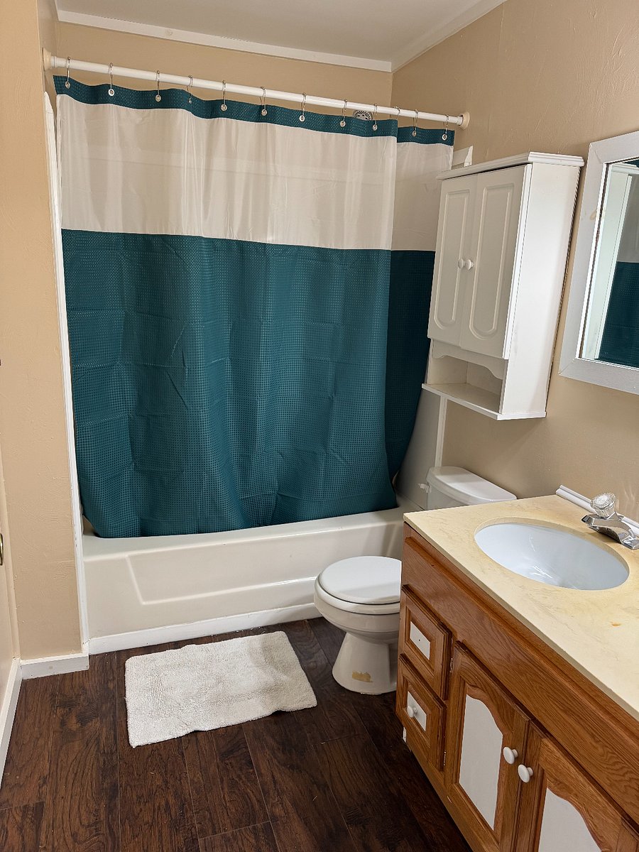 Full bathroom with tub/shower and 2 sinks