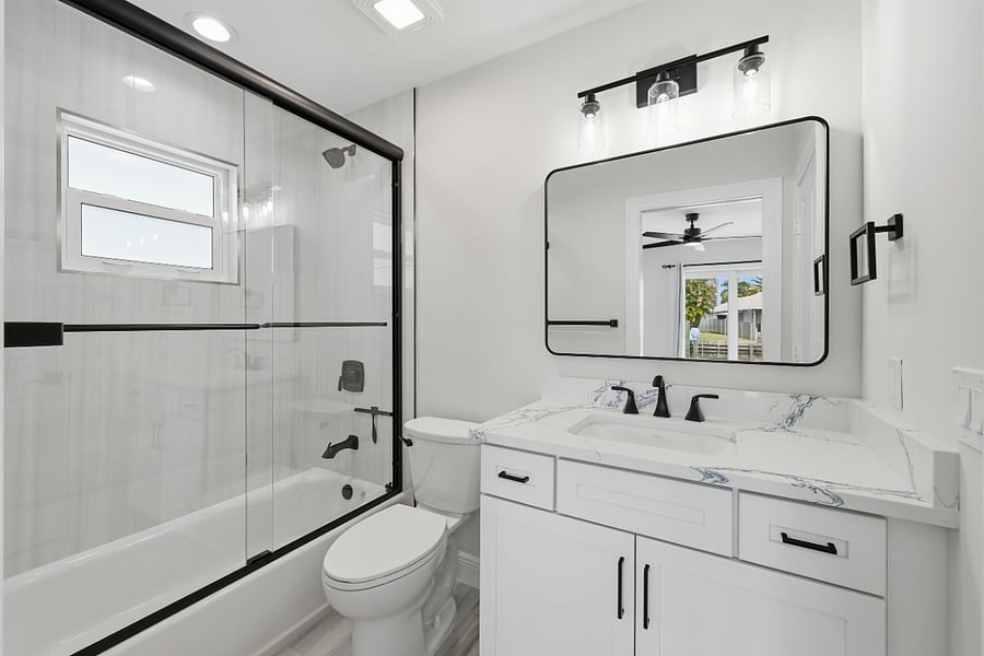 View of queen bedroom/dual-entry bath with walk-in shower.