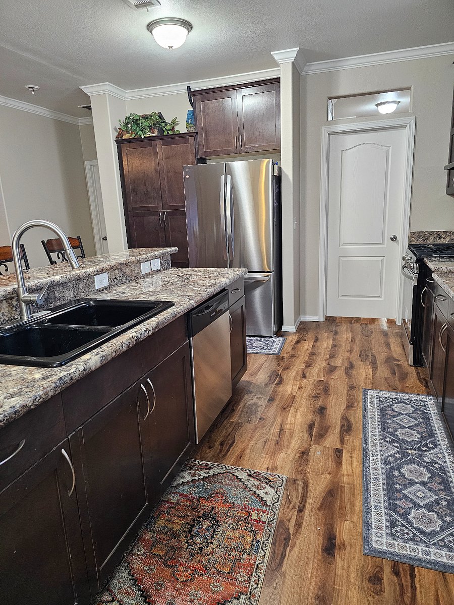 Fully equipped kitchen with new stove refrigerator dishwasher and microwave plus ample counter space for cooking and entertaining