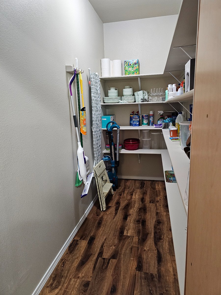 Spacious walk in pantry providing ample storage for groceries supplies and longer visits.