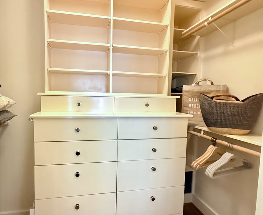 Spacious walk-in closet with floor-to-ceiling shelving and built-ins!