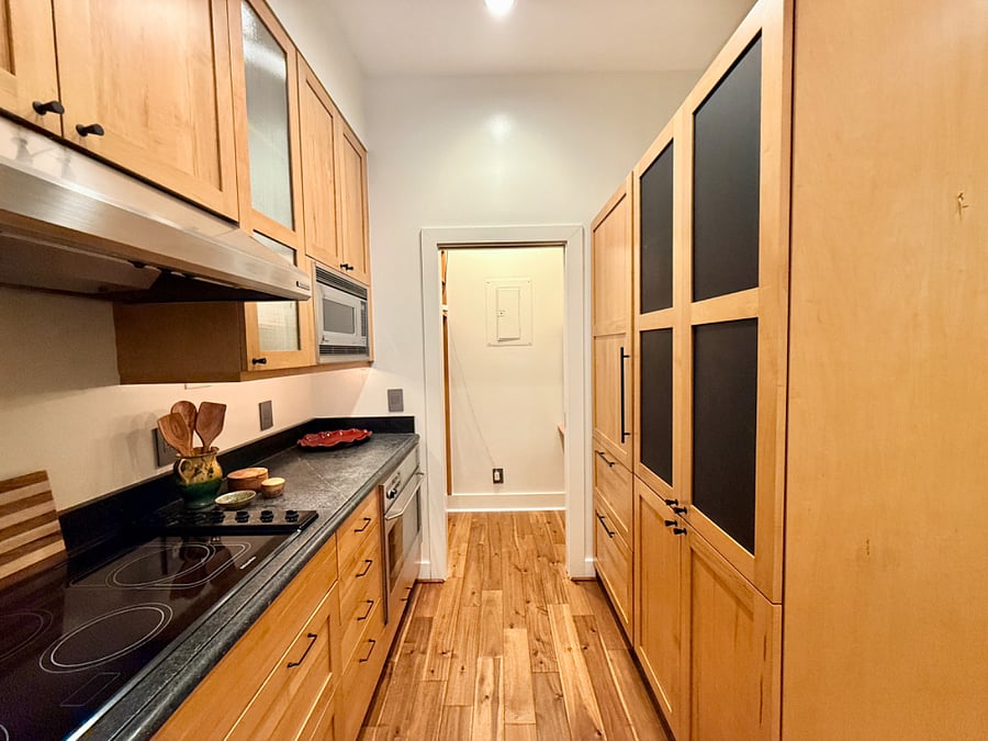 Premium GE, Miele, and Fisher & Paykel appliances, & abundant cabinetry