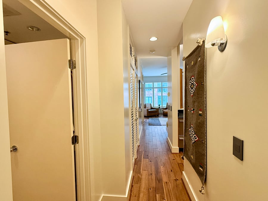 As you enter the front door, bathroom and storage on your left, kitchen entrance on right