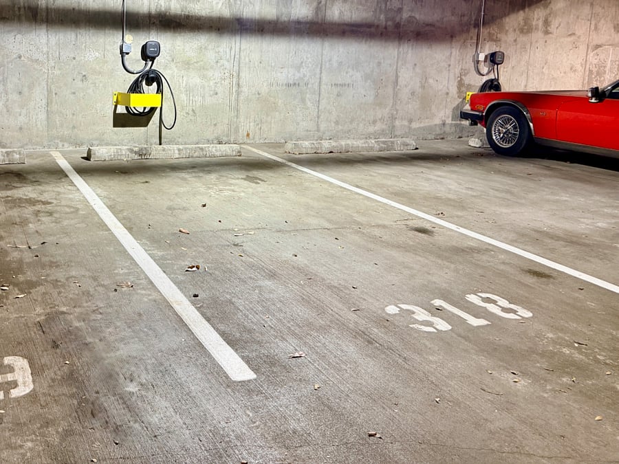 Optional reserved parking space with EV charger in secure garage