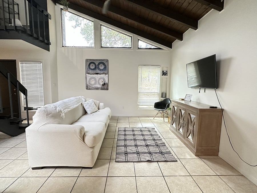 Living area open to the kitchen. Stairs leading to the upstairs bedrooms.