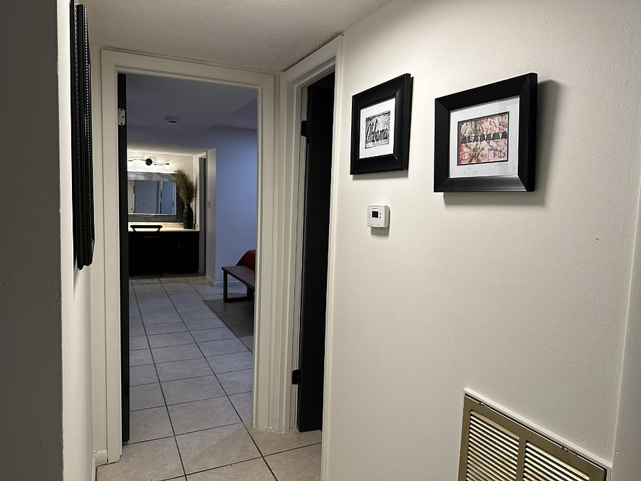 Downstair hallway to large main floor bedroom with bathroom access