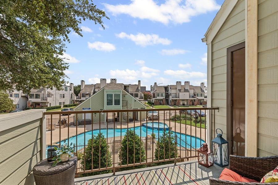 patio with large storage unit overlooks pool are