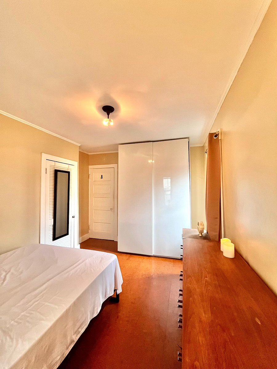 Furnished bedroom with wardrobe