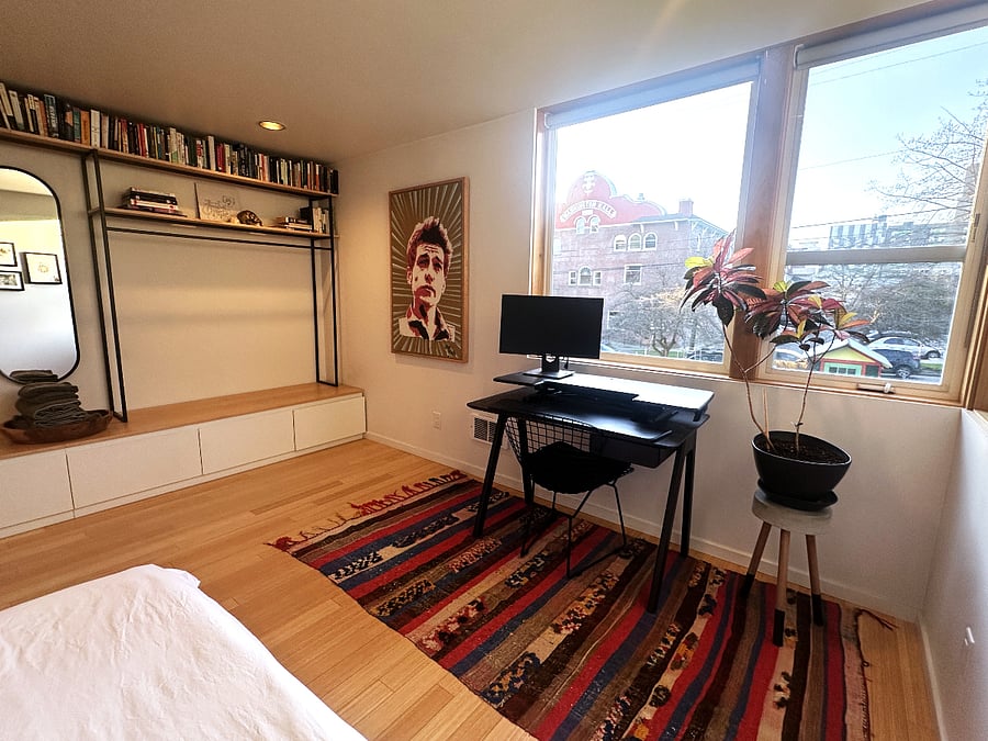 1st floor bedroom with work station and garden view