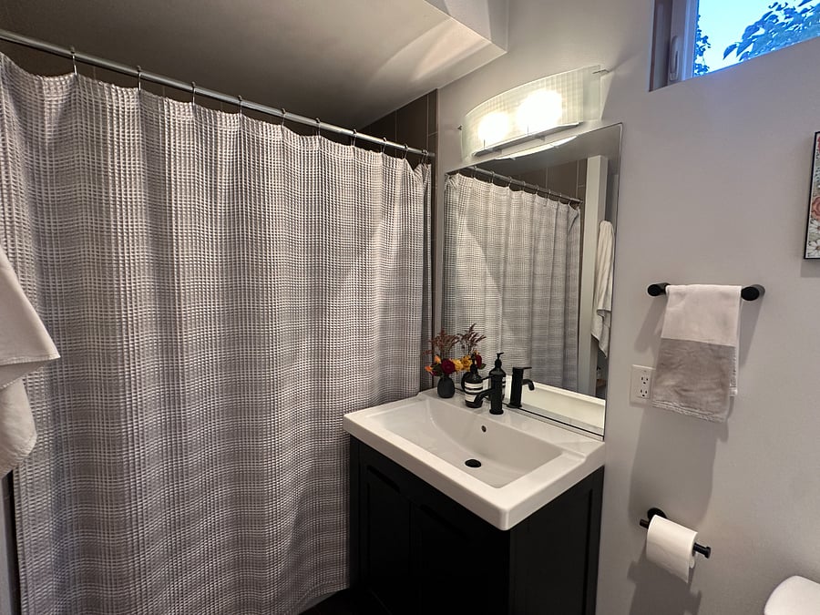 1st floor bathroom with tub and shower