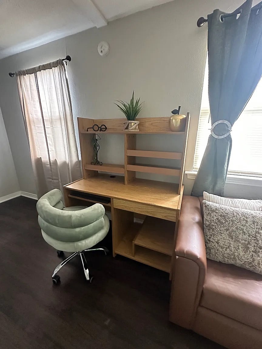 A dedicated workspace designed for productivity. Features a sturdy desk and comfortable chair in a quiet corner of the homeperfect for charting, remote work, or study sessions.