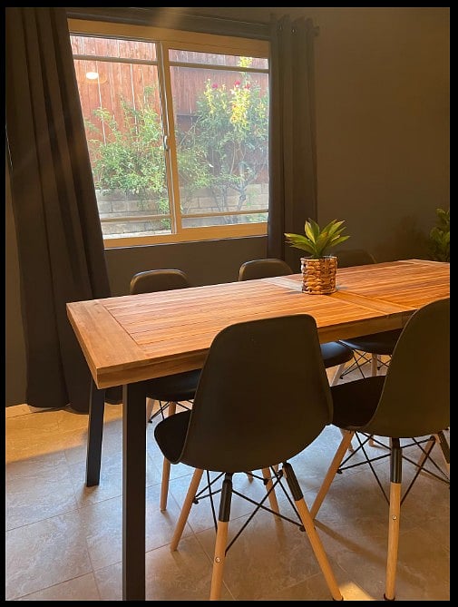 Bright dining area with plenty of seating, perfect for enjoying meals and morning coffee.