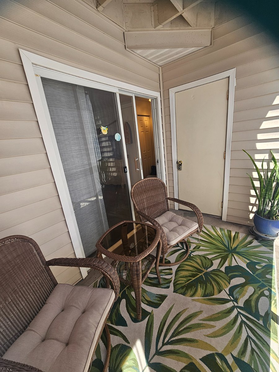 Lanai off of living room with privacy blind for relaxation