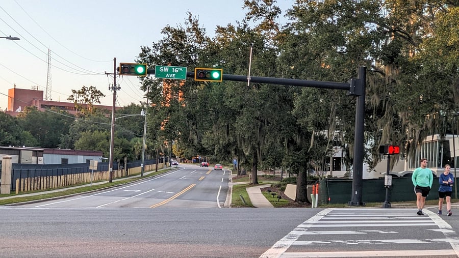 Cross the street and walk a block to UF Health/Shands, the brick building. UF Heart, Vascular, Neuro and Cancer Hospitals are on the right.