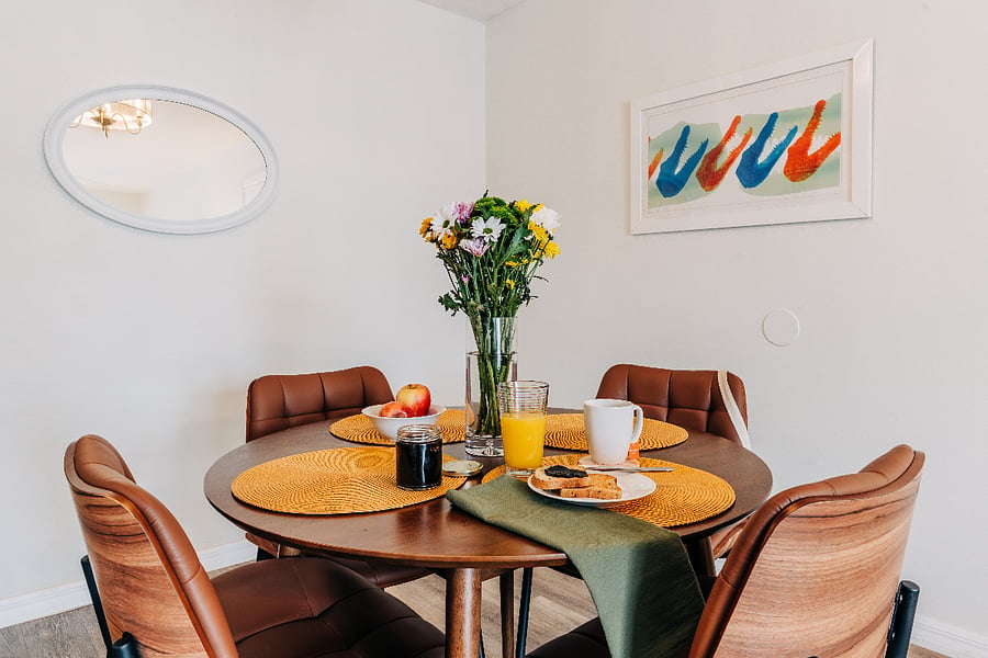 Dining space for meals, coffee, or spreading out with a laptop and study materials. Placemats and cloth napkins.