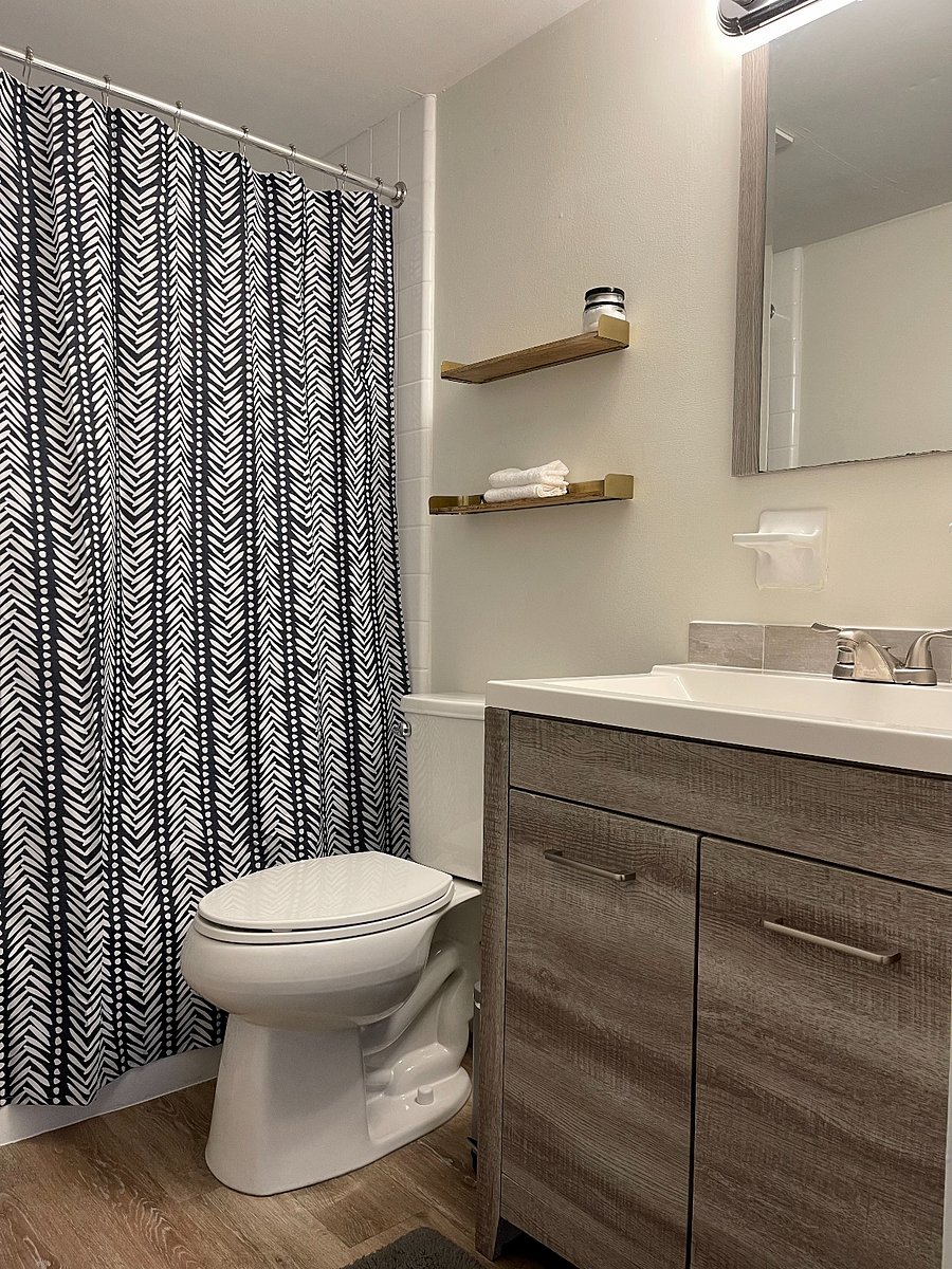 Immaculate, fully stocked bathroom with fresh towels and supplies provided.