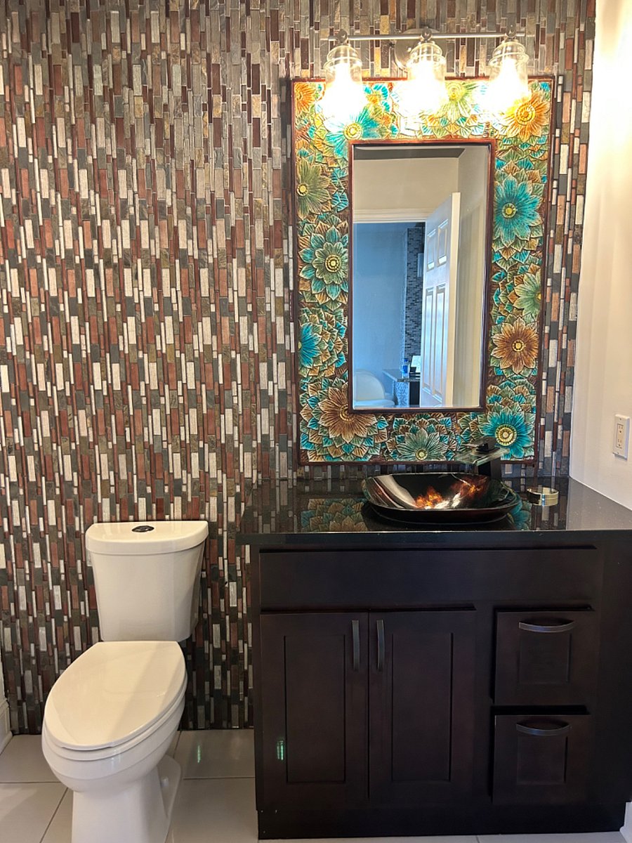 Well-placed powder room, perfectly situated for entertaining on the main level.