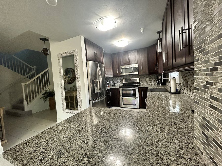 Open kitchen offering ample counter space and a seamless flow to living areas