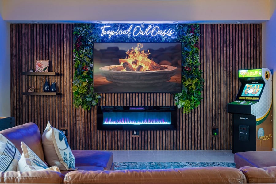 Game Room/ Living Room 
Featuring a fireplace, Golf Arcade, Shuffle Board, Arcade Games, Darts, and Skeeball.