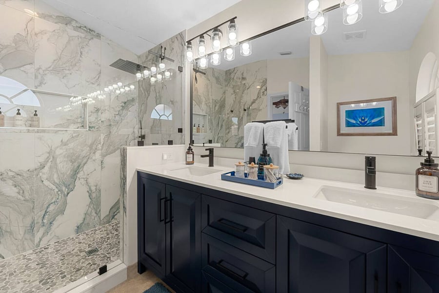 Tropical Room In-Suite Bathroom. Featuring a walk-in shower and double sinks.