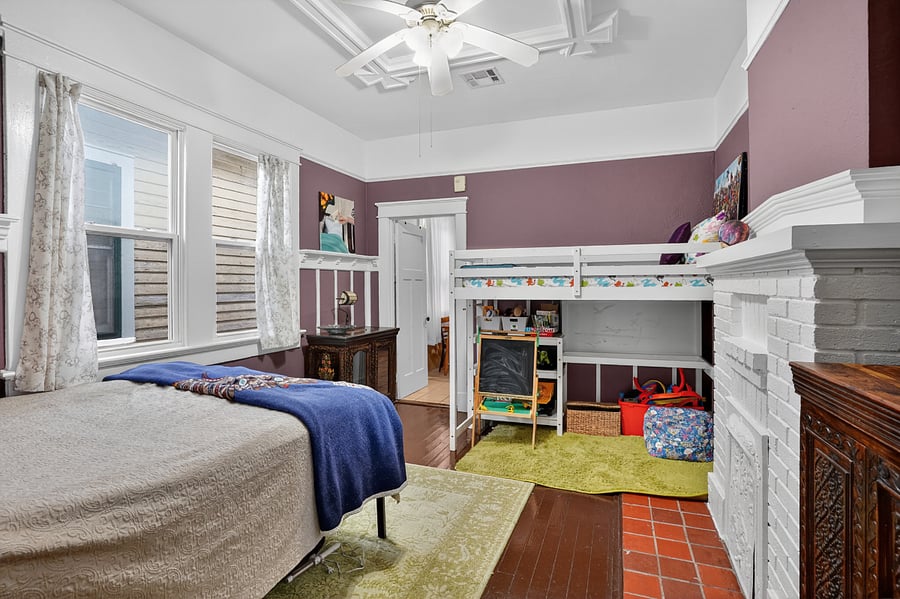 The primary bedroom also features a lofted bed for children.