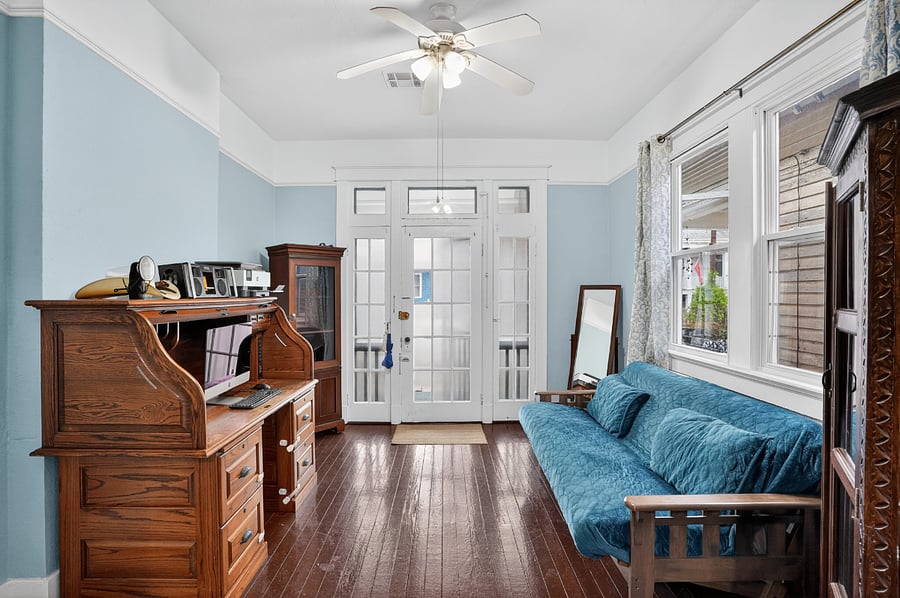 Entry, with a desk and futon for guests.