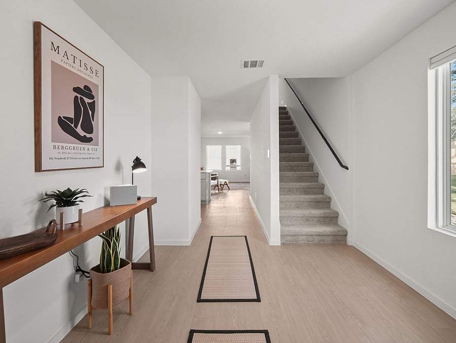 Graceful stairway leading to the second-floor game loft and relaxing 4 KING bedrooms.