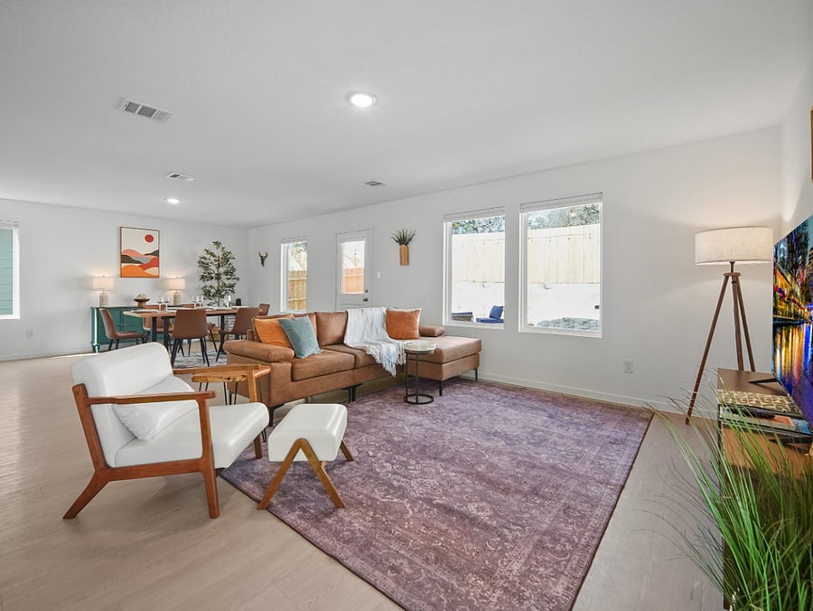 Enjoy serene backyard views from the comfort of the living room  a perfect spot to ease into the day with coffee and quiet reflection.