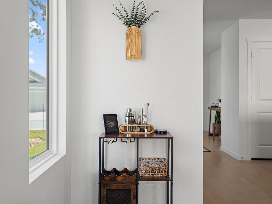 This cozy bar area offers a simple space to mix your favorite beverage while enjoying peaceful views of the front yard.