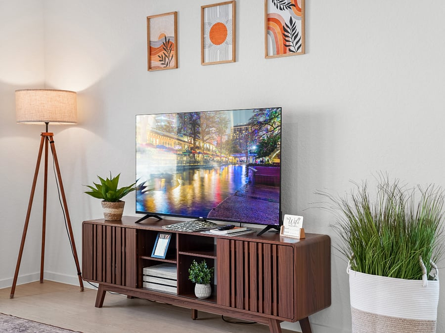 Inside the TV console, discover a collection of board games and puzzles  because sometimes a cozy puzzle beats high-stakes poker.