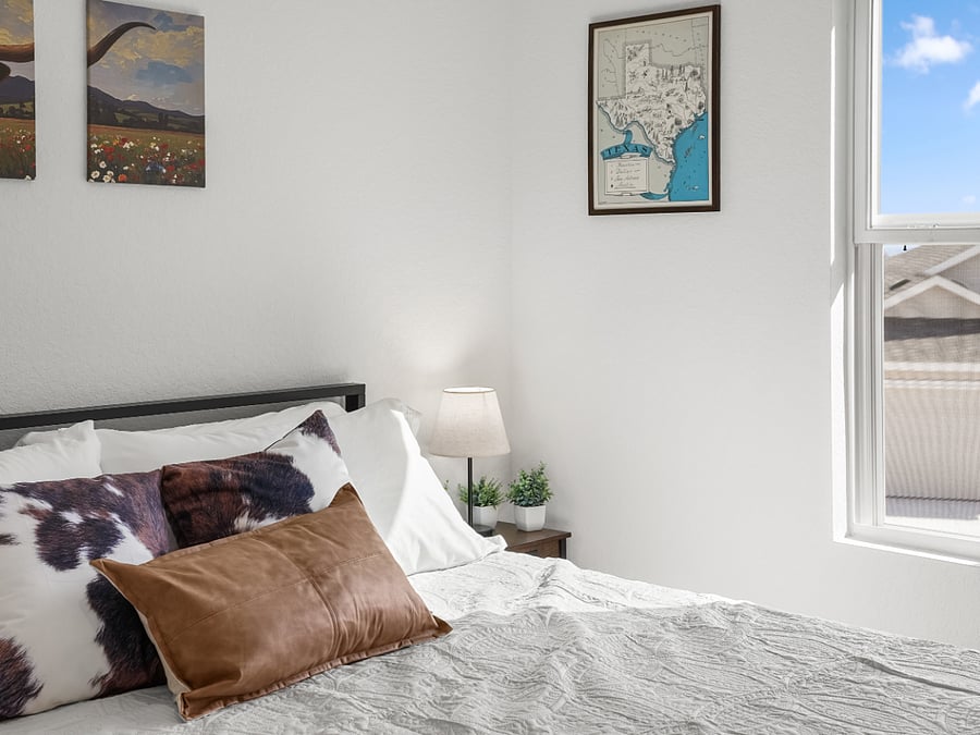 This king bedroom pairs modern comfort with a nod to the rugged spirit of the Texas cattle drives  where Western heritage meets restful retreat.