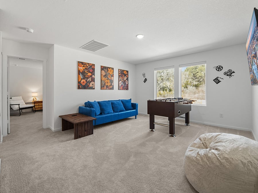 The upstairs flows seamlessly from fun and friendly competition in the game loft to peaceful relaxation in the nearby 4 KING bedrooms  the perfect balance of energy and retreat.
