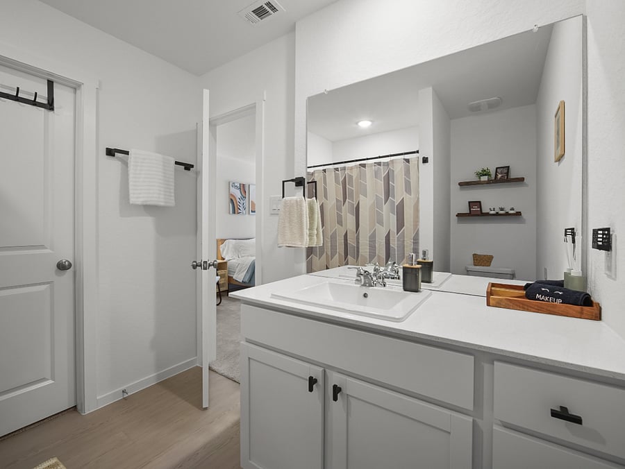 The private ensuite bathroom includes a generous walk-in shower and ample space to refresh and recharge in comfort.