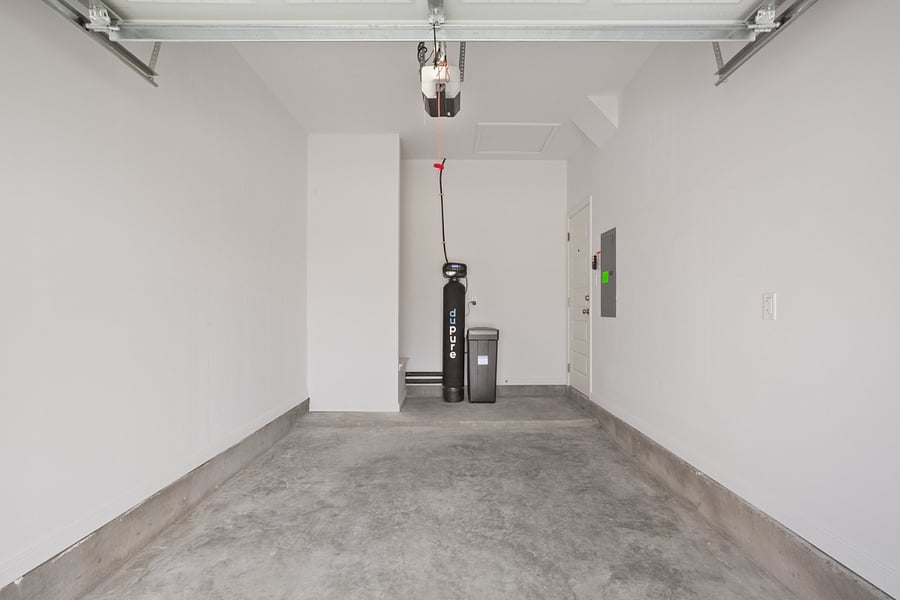 Secure garage with whole house water filtration system and water softener
