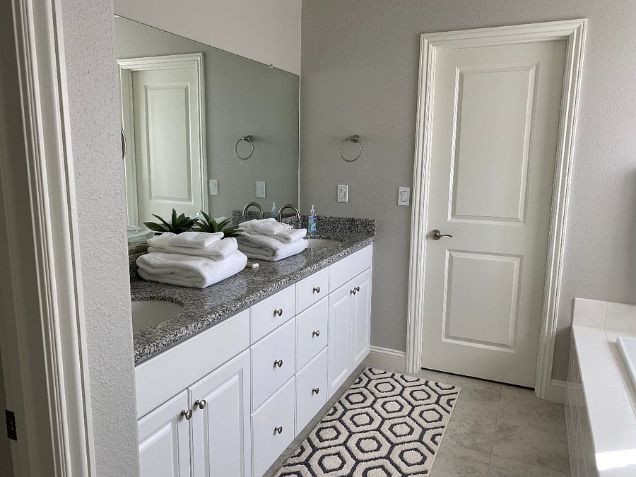 Primary bath has large walk-in closet, large tub and shower