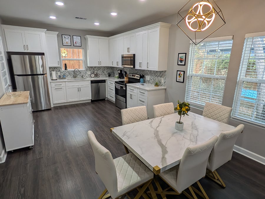 The kitchen features a full size refridgerator, microwave, oven, stove top, keurig coffee maker, toaster, and pots and pans for making meals in the lake house.