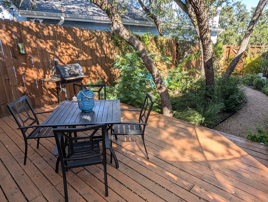 The end of the deck gives way to the beautiful backyard garden.