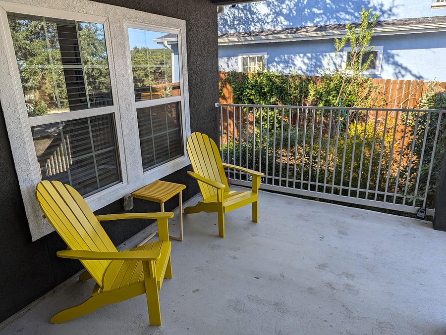 The patio overlooks the side garden area.