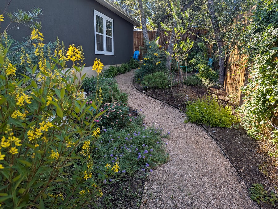 The beautiful garden adds a peaceful place to relax and enjoy the outdoors.