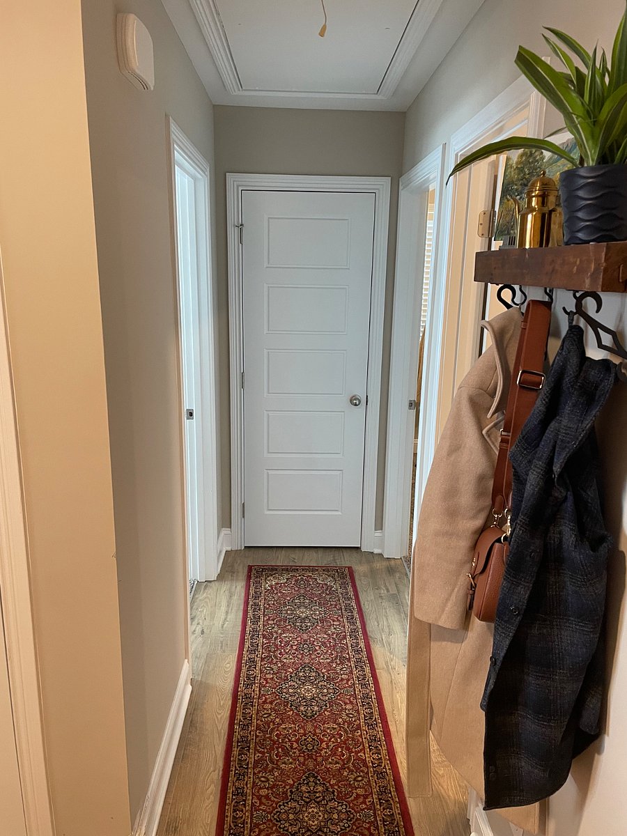 Hallway to bedroom 2 and 3 with hallway closet