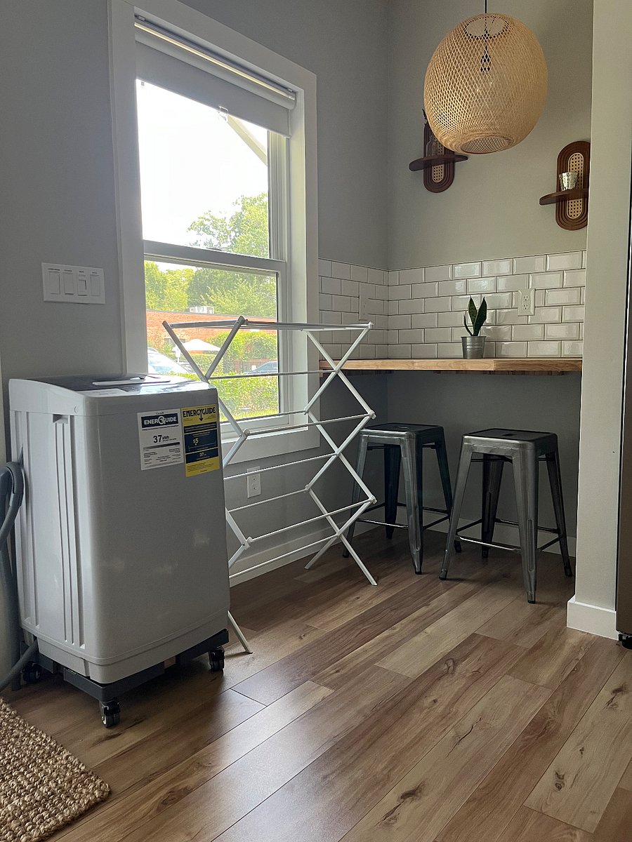 Portable washer (dryer photos coming) They both easily fit side by side in front of this window. They also have wheels and can be moved easily. Drying rack for delicates. 
