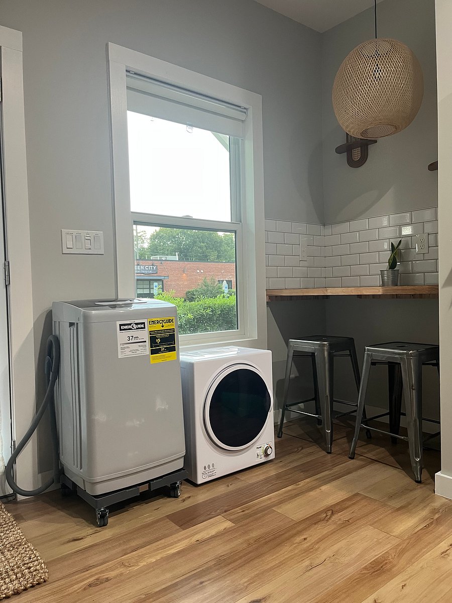 Portable washer and dryer fit right in front of the window. Washer is on rollers for ease of use.